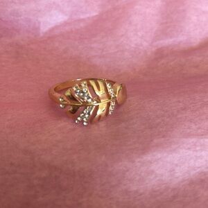 Gold tone leaf custom jewelry ring.
